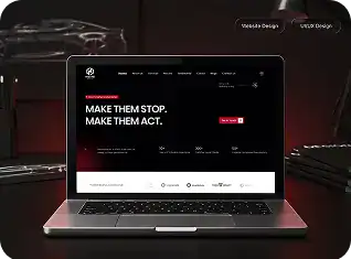 Laptop displaying WAZ Tech Studio website with dark background and modern design.