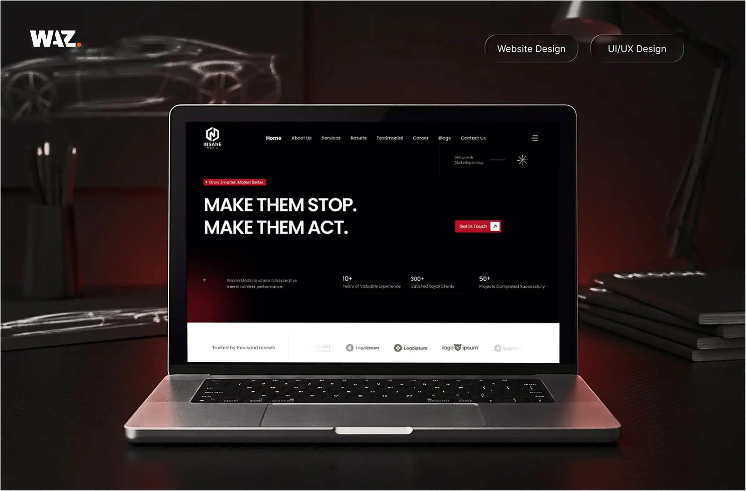 Laptop displaying WAZ Tech Studio website for UI/UX and web design.